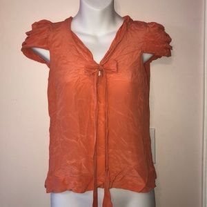 Odille 100% Silk cap sleeves bow front top